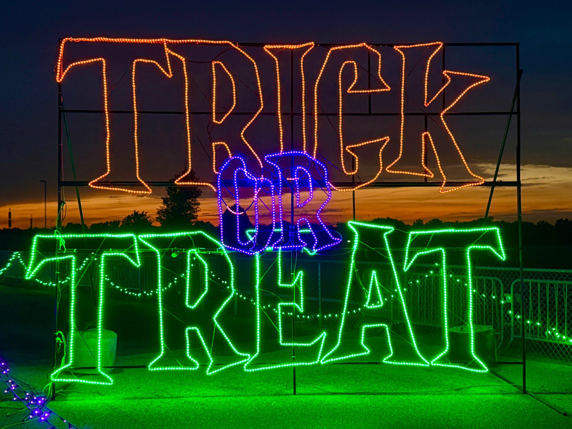 Trick-or-treat light display with glowing jack-o’-lanterns